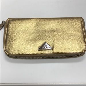 Pre- owned gold wallet by Prada